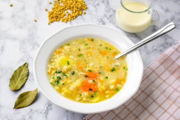 Krupnik, traditional polish barley soup with vegetables