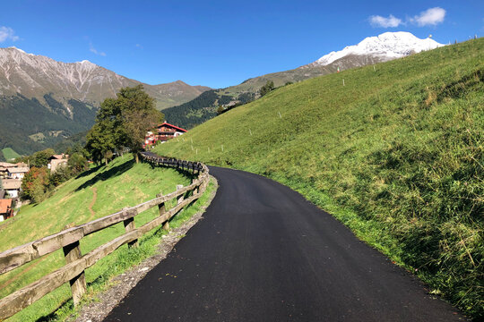 Beautiful Mountain Road of Zambla Alta Mountain Village with View on Mount Arera and Serina Valley, Italian Alps, During a Sunny Summer Day. Bergamo Province, Italy
