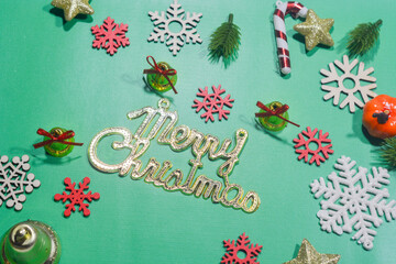 Elegant Christmas background with green and gold decorations, including baubles, stars, and wrapped gifts. Perfect for festive holiday themes, greeting cards, and seasonal promotions