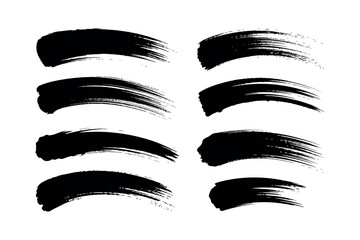 Eight black brush strokes arranged in two rows on a plain white background