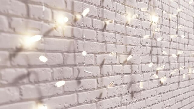Twinkling christmas string lights on a white brick wall