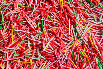 Pile of colorful raw crackers on a white background