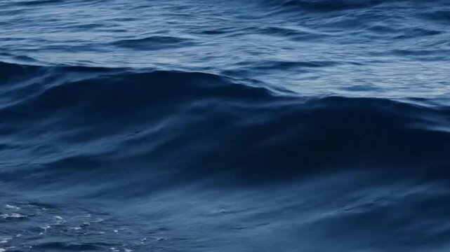 Deep Blue Ocean Surface with Gentle Waves and Ripples Under Natural Sunlight in Daylight Creates Peaceful and Serene Atmospheric Mood Optimized for Adobe Stock