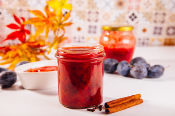 Homemade plum jam and fresh organic plums