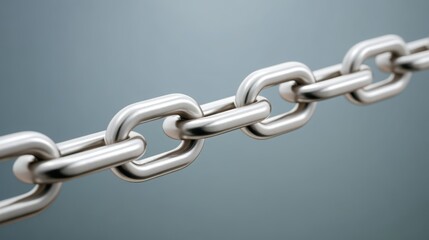 Fototapeta premium Metal chain links displayed against a soft background, emphasizing strength and connectivity.