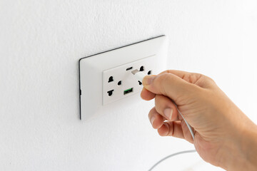 Close-up of Mobile Device Charging from USB-C Port in Electrical Wall Socket