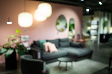 Abstract, blurred view of a furniture showroom.  Wide angle view, bokeh background, no people
