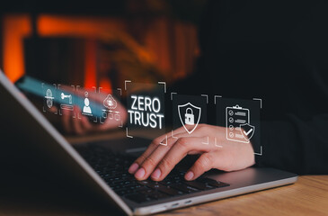 Zero trust cybersecurity and data protection concept. Person using laptop with icons of locks, networks, identity verification, symbolizing zero trust security model, digital data protection strategy