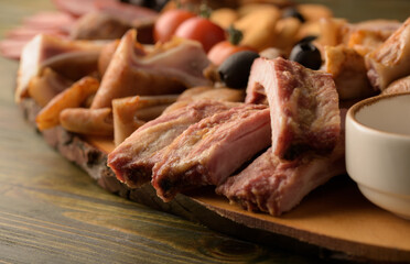 assorted pork meat on a wooden bottom