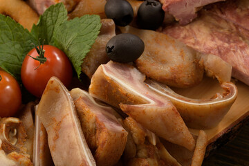 assorted pork meat on a wooden bottom