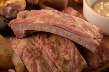 assorted pork meat on a wooden bottom