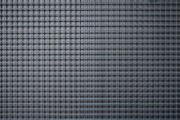 Background texture of a stainless steel mesh window.