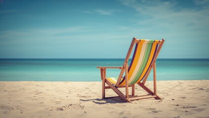 Beach chair positioned on sandy shore, inviting relaxation under the sun, summer getaway