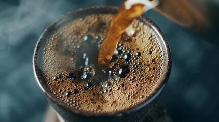 Pouring a rich, aromatic cup of freshly brewed hot coffee