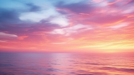 Obraz premium A serene view of a vibrant sunset over calm waters, showcasing hues of pink, purple, and blue in the sky.