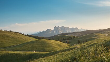 Lush rolling hills and rocky terrain under a bright summer sky