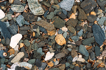 Close-up of rough multicolored pebbles and stones texture. High quality photo