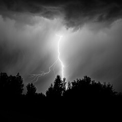 beautiful lightning during a thunderstorm at night in a forest that caused a fire, against a dark...