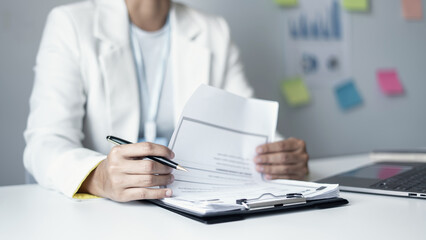 Business woman employer holding resume hiring recruit looking cv resume to hire candidates, analyzing information before job interview. Recruitment concepts