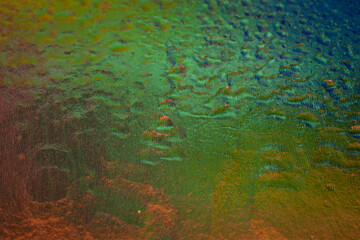 Wet texture. Abstract texture with a color gradient. Selective focus