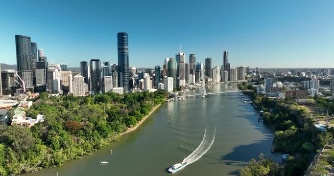 4K pull out tracking motion of New Kangaroo Point Bridge crossing the Brisbane River with Brisbane CBD in background, it is a pedestrian bridge only, opened late 2024, Brisbane, QLD, Australia