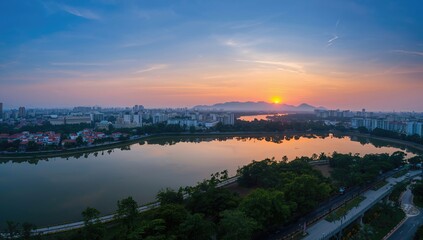 Fototapeta premium Twilight aerial view over Hoang Cau lake, showcasing urban density