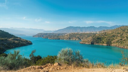 Natural underground formations surrounded by water and sky in a scenic summer landscape