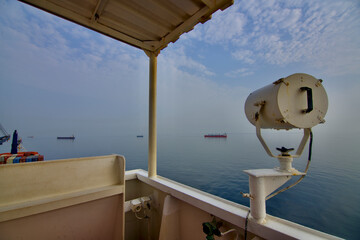 View from the bridge wings of a ship at sea in the Anchorage area in the early morning