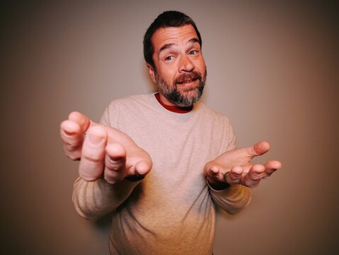 Six-Seven 6-7 67 Meme Trend - Middle Aged Dad Demonstrating Gestures Involved with Latest Craze Among Kids, Tweens, Teens, and Social Media