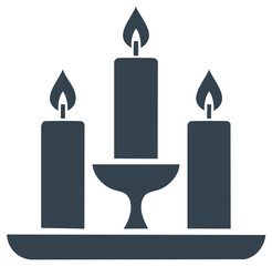 Obraz premium Three burning candles on a decorative stand offering light warmth and a peaceful glow