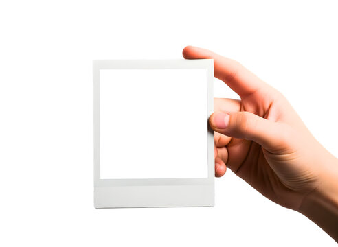 Hand holding a blank polaroid photo frame isolated on transparent background
