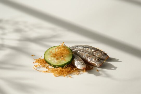 Pickled cucumber salad with seaweed and small sardines