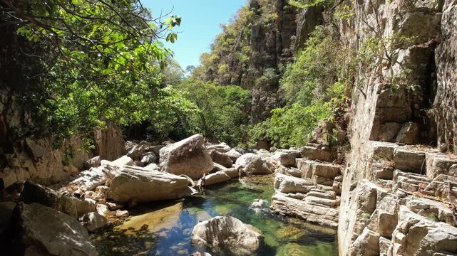 canyons and valley Guardian waterfall,  Vao do Moleque community in Chapada dos Veadeiros,  blue water, sunny day, incredible landscape