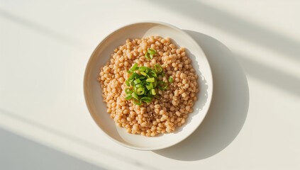 Dish of buckwheat served on a light background