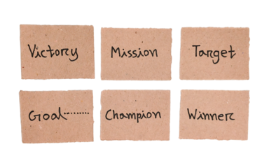 Handwritten Victory, mission, target, goal, champion and winner Concepts on Brown Cardboard Labels