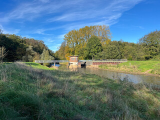 river and bridge with blue sky in landscape