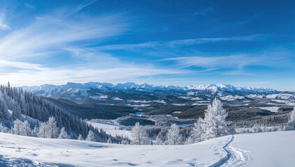 Scenic winter mountain landscape with snowy peaks under a clear blue sky