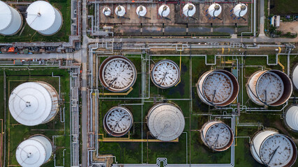Aerial top view of oil and gas petrochemical storage tank and pipeline steel, Oil and gas transportation system pipeline steel at oil and gas refinery industry chemical plant, Pipeline oil and gas.