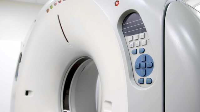 CT scanner machine with advanced technology features, showcasing intricate design and control panel, representing modern x-ray diagnostic imaging equipment in a clinical environment