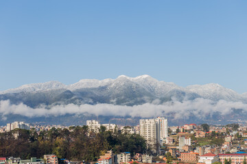 Snowfall in Kathmandu City with Hills Covered in Snow