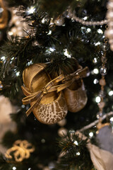 A close-up of a decorated Christmas tree with twinkling decorations. A Christmas tree decorated...