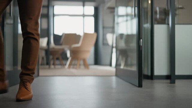 legs of man entering modern office