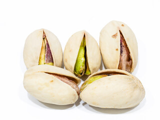 Heap of tasty pistachio nuts isolated on white background