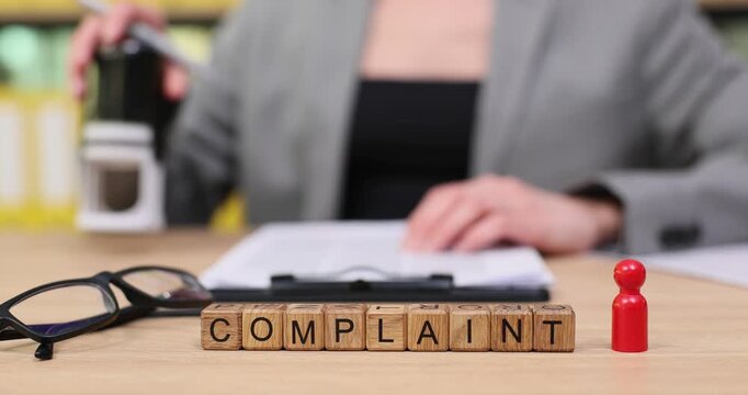 Filing a complaint in a busy office with focus on professionalism and determination