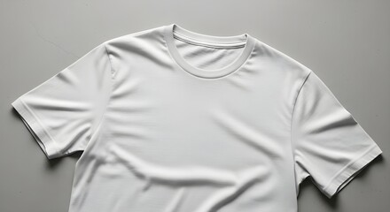 Clean white t shirt mockup with crew neck and short sleeves on a gray background