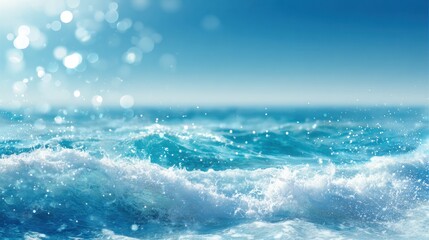 Fototapeta premium Waves gently crash against the shore under a clear blue sky creating a serene coastal scene.