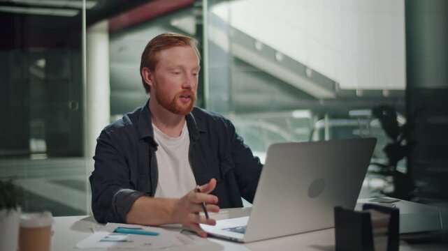 Communication, Remote Meetings, Online Presentation, Zoom Culture A Man Focused on His Daily Office Work Takes a Video Call to Handle Business Matters. Scene of Digital Collaboration, Modern Workflow
