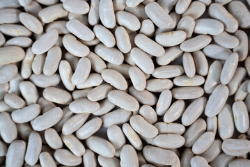 Macro image of white beans filling frame. Great for clean food visuals, diet plans, and healthy lifestyle content. 