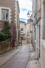 Obraz premium Blois, France - 10 27 2025: Panoramic view of a typical Renaissance cobblestone street with stone facades