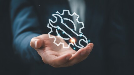 Hand holding a glowing wrench and gear icon symbolizing service or repair